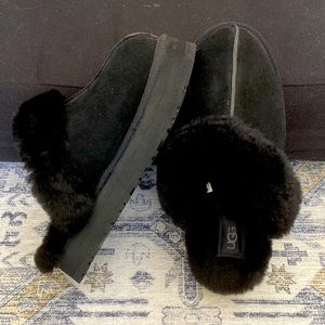 Black UGG slipper boots size US 8 . Never worn outside. In brand new condition